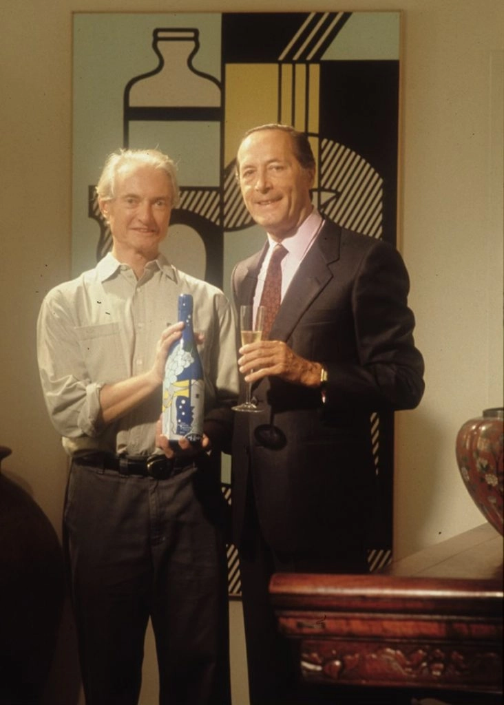 Claude Taittinger et l’artiste Roy Lichtenstein, invité en 1985 à imaginer une oeuvre pour habiller un millésime dans le cadre de la Taittinger Collection